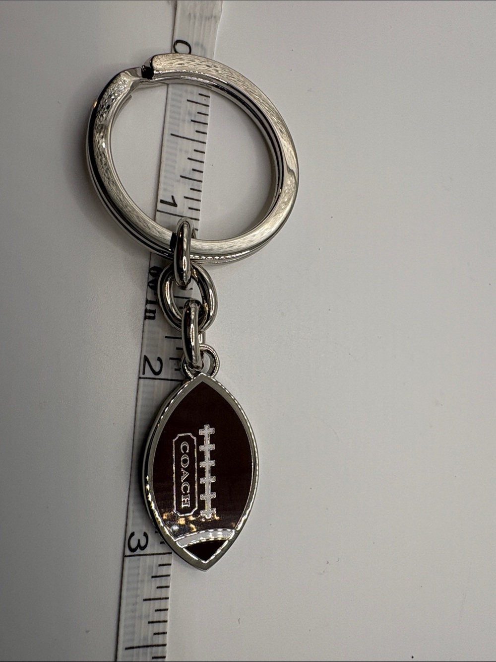 Coach Silver-Tone Dark Brown Football Charm Keyring